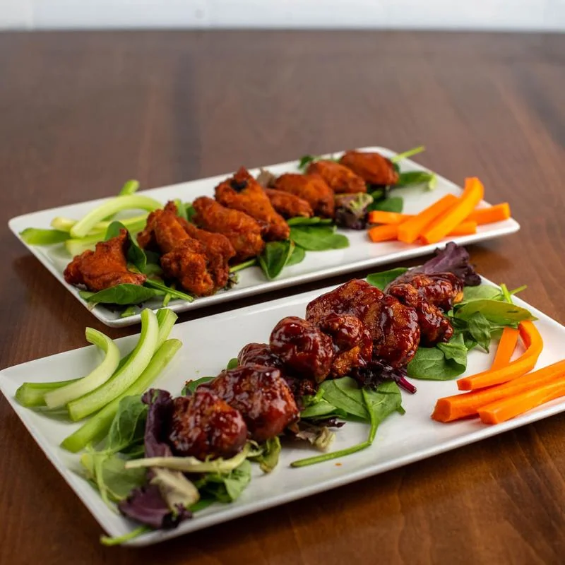 BBQ boneless and Buffalo bone-in wings with celery